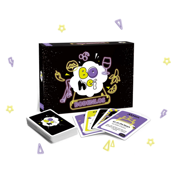 Schwarze Brettspielbox mit bunten Food- und Getränkesymbolen neben verstreuten Spielkarten.